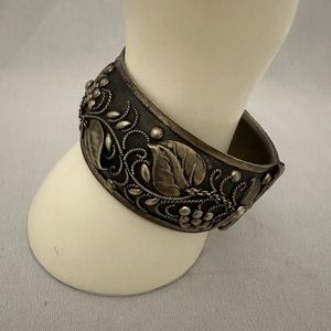 Vintage silver and black bangle bracelet with pin closure and grapevine design
